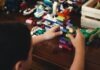 child playing with lego blocks