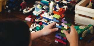 child playing with lego blocks