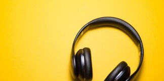 flatlay photography of wireless headphones