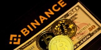 gold round coin on brown and black box