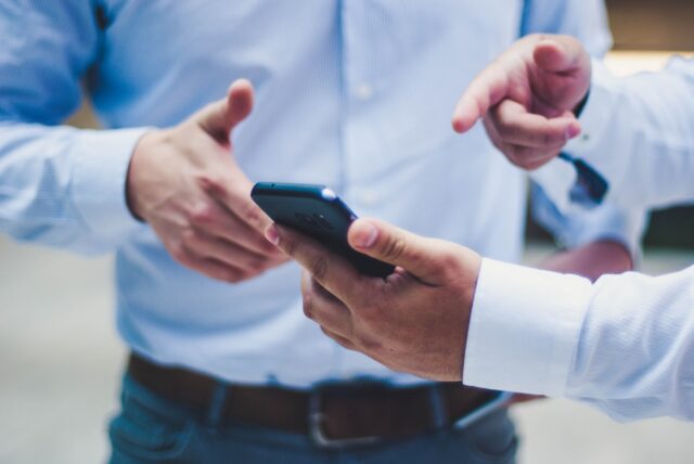 Photo by Luis Villasmil person holding black smartphone