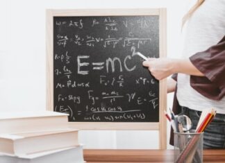 E-mc2 written on chalkboard