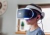 boy wearing black and white VR headset