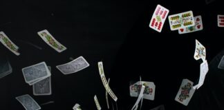 playing cards on black textile