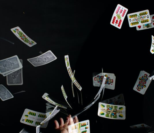 playing cards on black textile