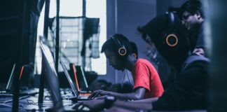 man playing on laptop