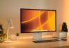 a computer monitor sitting on top of a desk