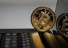 two gold Bitcoins