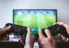 Gamingcy: The Ultimate Destination for Professional Game Boosting Services two people playing Sony PS4 game console