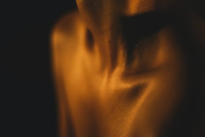 Photo by Ramez E. Nassif a blurry photo of a person's torso