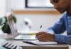 man, writing, laptop