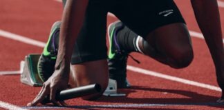 man on running field