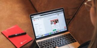 macbook pro on black leather couch