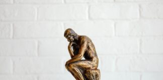 brown concrete statue of man