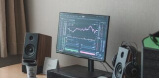 black flat screen computer monitor turned on beside black computer keyboard