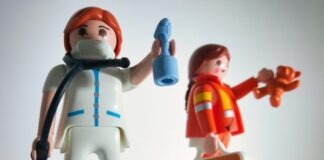 boy in blue and white suit plastic toy