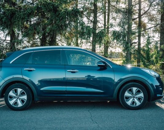 blue car parked on the side of the road