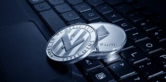 silver and black round analog watch