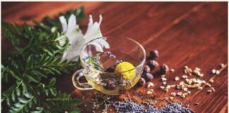clear tea cup on brown surface