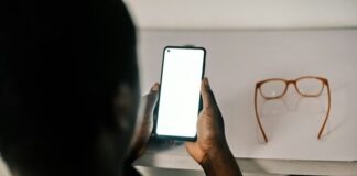 person holding white android smartphone