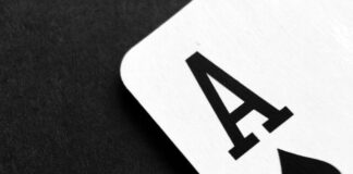 Free Ace of Spade Playing Card on Grey Surface Stock Photo