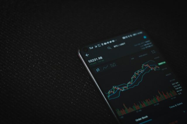 Photo by Viktor Forgacs black android smartphone on black textile