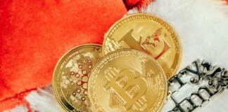 two gold bitcoins sitting next to each other