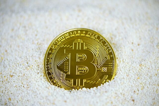 Photo by Kanchanara gold and black round coin