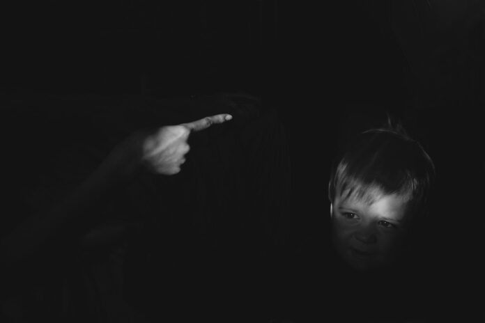 Photo by Artyom Kabajev grayscale photo of girl holding her chin
