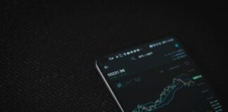 black android smartphone on black textile