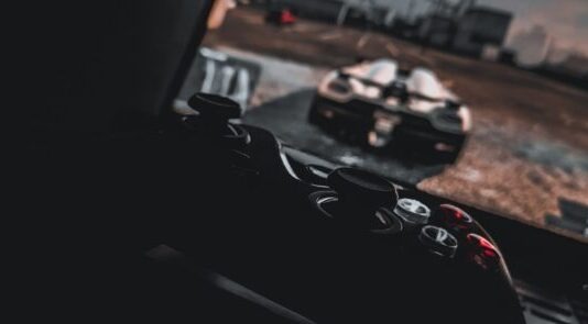 black dslr camera on black surface