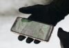 person holding iphone 6 with case