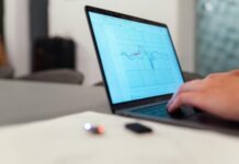 person using black laptop computer