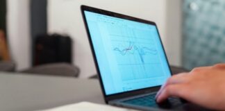 person using black laptop computer