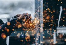 person holding tool during daytime