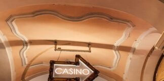 a casino sign hanging from the ceiling of a building