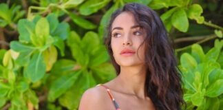woman in white and red stripe tank top