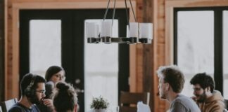 sittin people beside table inside room