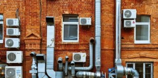 a building with a bunch of pipes on the side of it