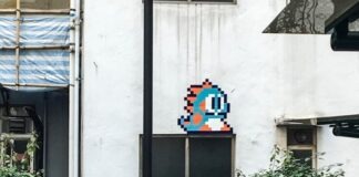 black street light near white concrete building