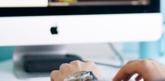 person in front of iMac