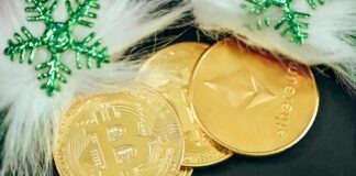 a pile of gold bitcoins sitting on top of a table