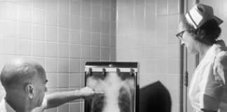 a man and a woman looking at a chest x - ray