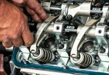 a close up of a person working on a machine