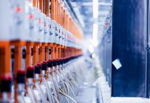 a row of orange and white electrical wires