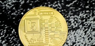 a close up of a coin on a black surface