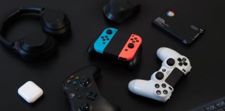 white and orange game controller