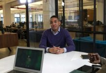How to Bounce Back Quickly After Losing Your Job as a Leader a man sitting at a table with a laptop