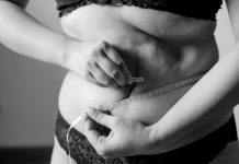 How to Restore Your Shape After Major Weight Loss grayscale photo of woman holding her breast