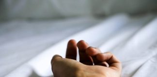 human hand on white textile